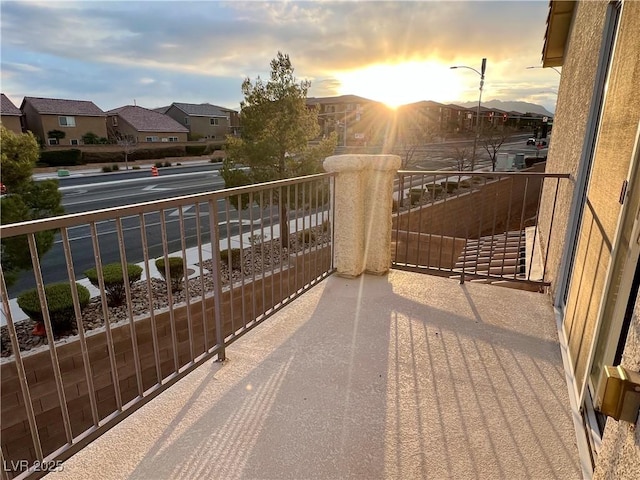 view of balcony at dusk