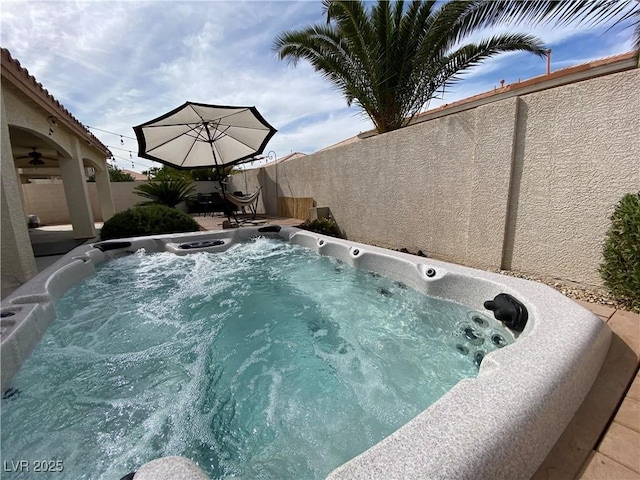 view of pool with a hot tub