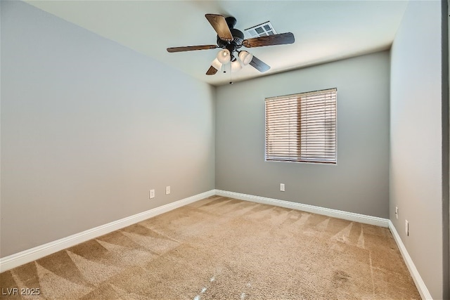 spare room with carpet floors and ceiling fan