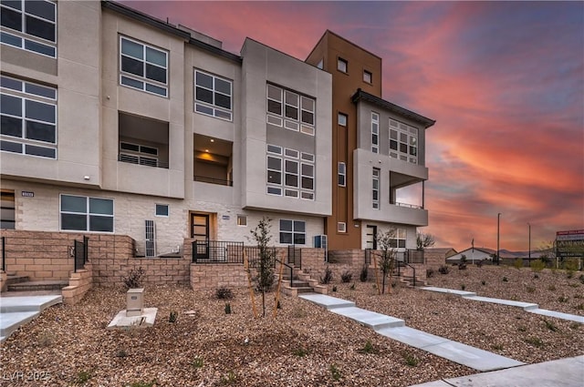 view of outdoor building at dusk