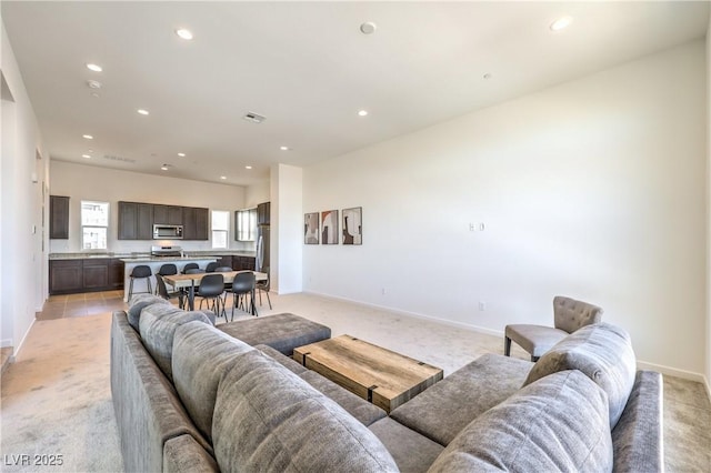 living room featuring light colored carpet