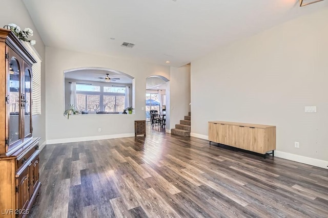 unfurnished living room with dark hardwood / wood-style flooring