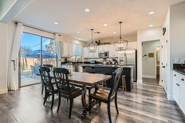 dining room featuring dark wood-type flooring and a mountain view