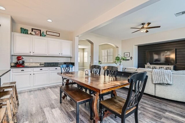 dining area featuring ceiling fan and hardwood / wood-style floors