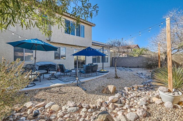 back of property featuring a patio area