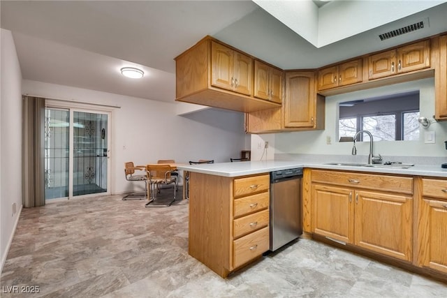 kitchen featuring dishwasher, sink, and kitchen peninsula