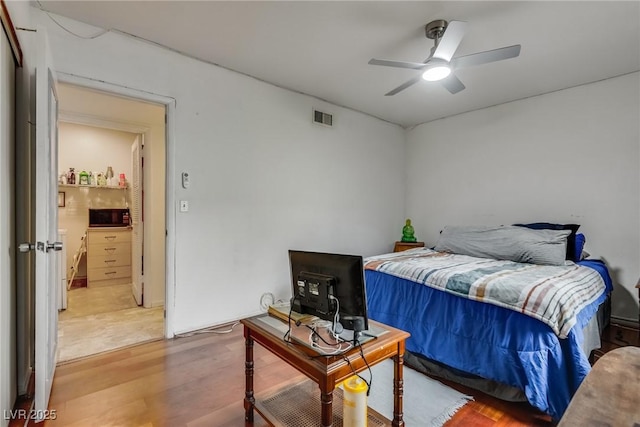 bedroom featuring ceiling fan and light hardwood / wood-style floors