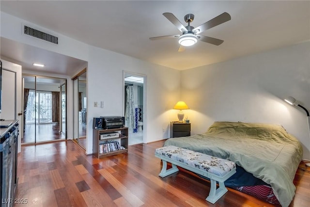 bedroom featuring hardwood / wood-style flooring and ceiling fan