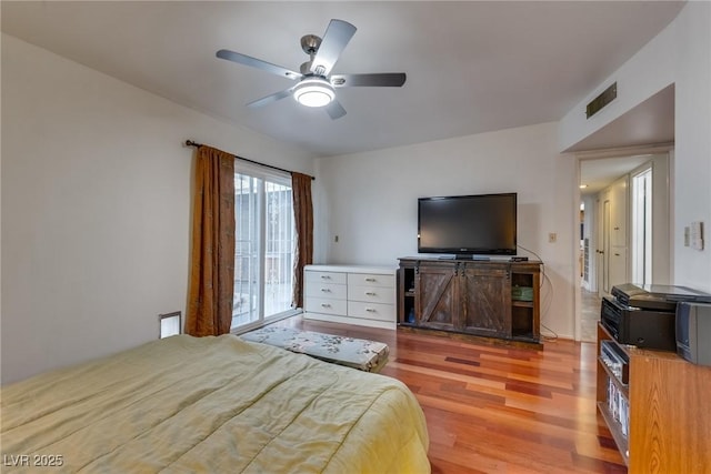 bedroom featuring ceiling fan and light hardwood / wood-style floors