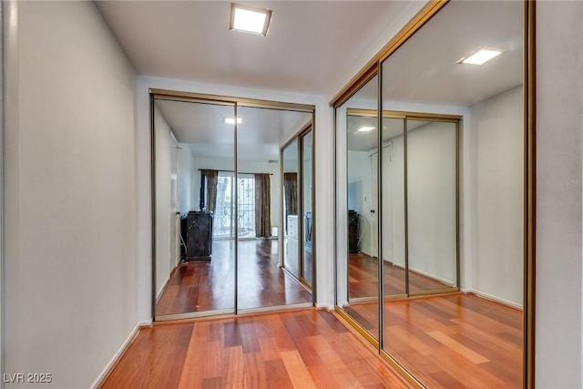 corridor featuring hardwood / wood-style flooring