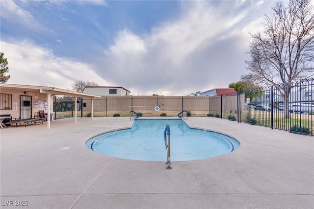 view of swimming pool featuring a patio area