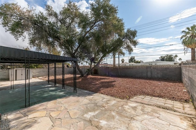 view of patio featuring a storage shed