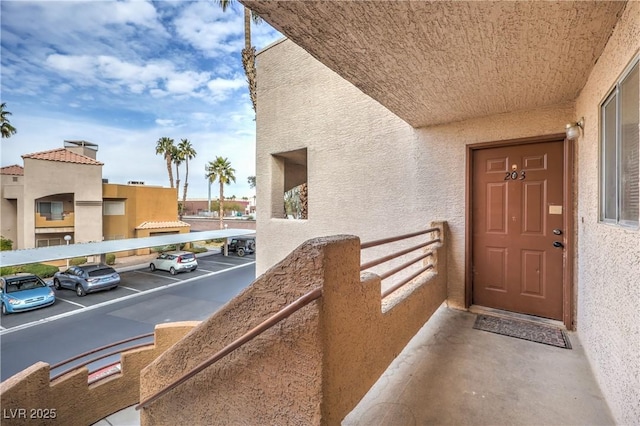 property entrance with a balcony