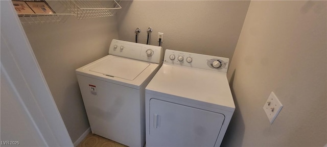 laundry room with washing machine and dryer