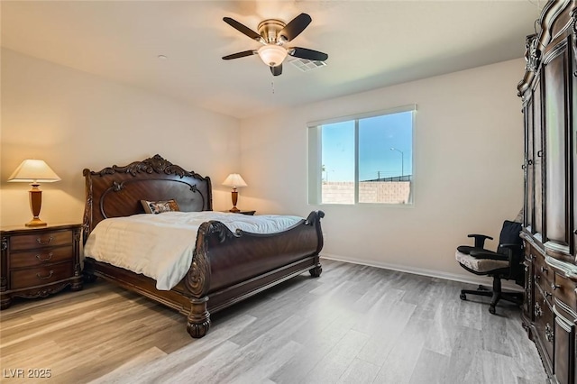 bedroom with ceiling fan and light hardwood / wood-style flooring