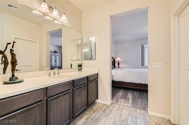 bathroom with vanity and hardwood / wood-style floors