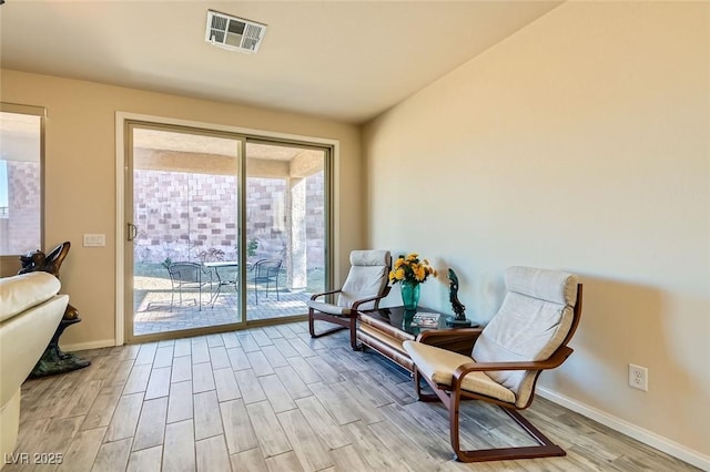 sitting room featuring light hardwood / wood-style floors