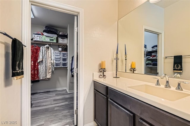 bathroom featuring vanity and wood-type flooring