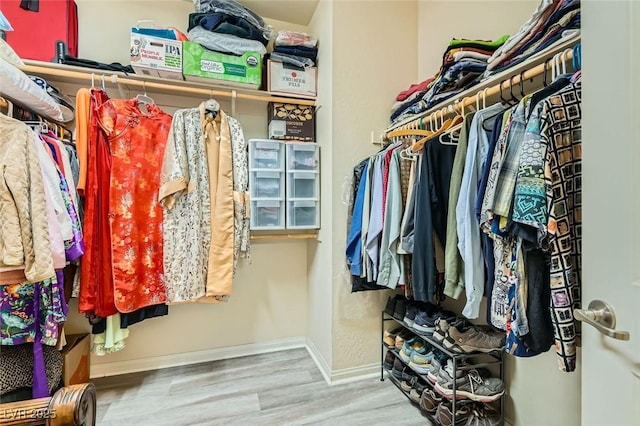 spacious closet featuring hardwood / wood-style flooring