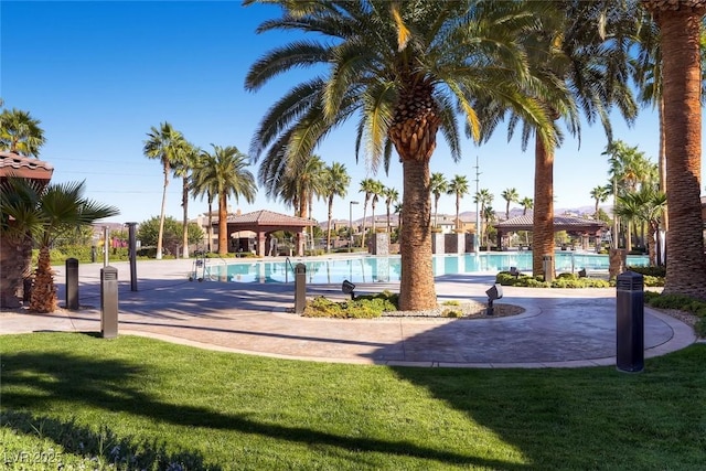 exterior space with a gazebo and a lawn