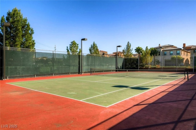 view of sport court featuring basketball hoop