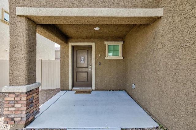 entrance to property with a patio area