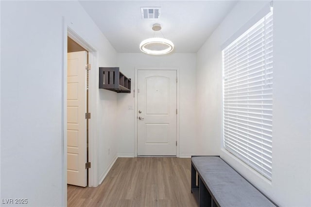 hall with light wood-type flooring