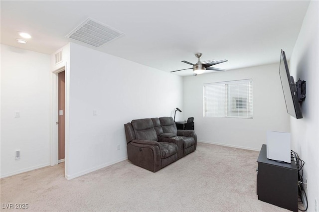 living room with light colored carpet and ceiling fan