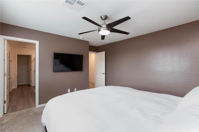 carpeted bedroom featuring ceiling fan