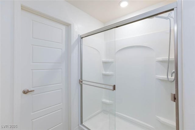 bathroom featuring an enclosed shower