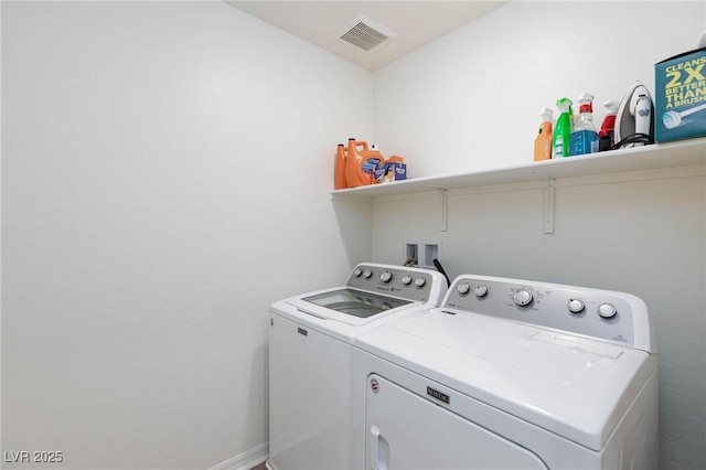 washroom featuring washer and clothes dryer