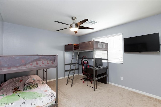 bedroom featuring ceiling fan and light carpet