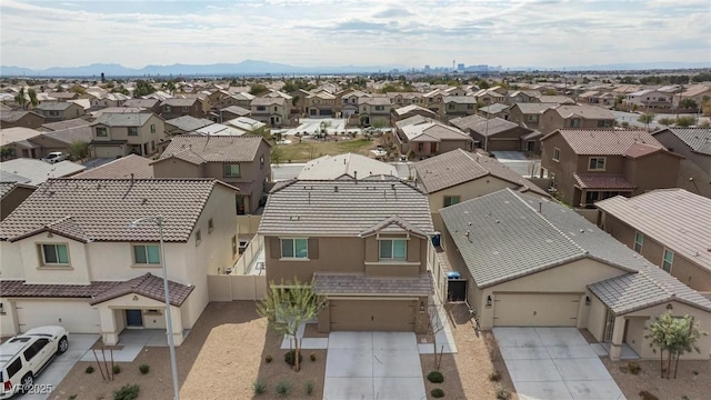 birds eye view of property featuring a mountain view