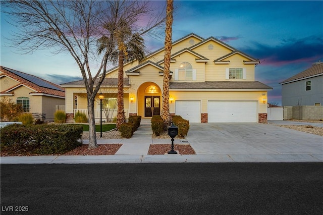 view of front of property with a garage