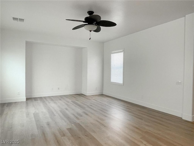 unfurnished room with ceiling fan and light hardwood / wood-style floors