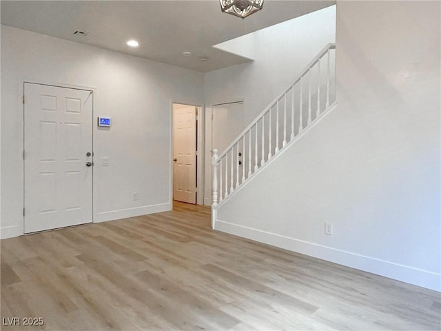 entrance foyer with light hardwood / wood-style floors