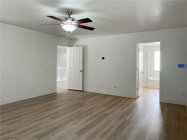 unfurnished room featuring ceiling fan and light hardwood / wood-style floors