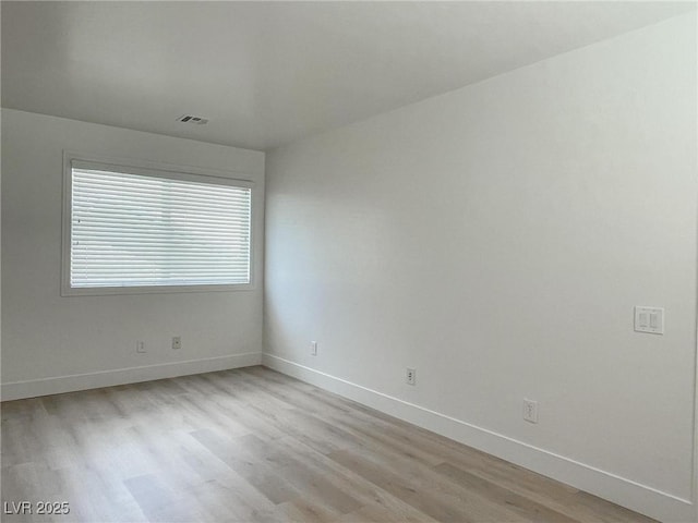 unfurnished room featuring light wood-type flooring