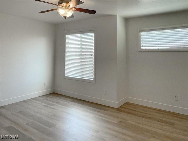 empty room with light hardwood / wood-style flooring and ceiling fan