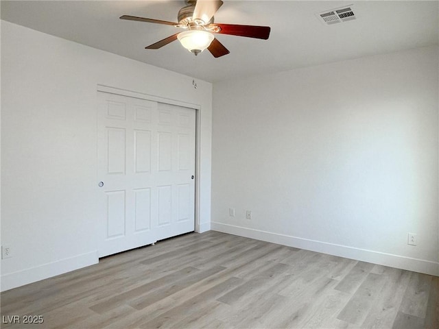 unfurnished bedroom featuring a closet, ceiling fan, and light hardwood / wood-style floors