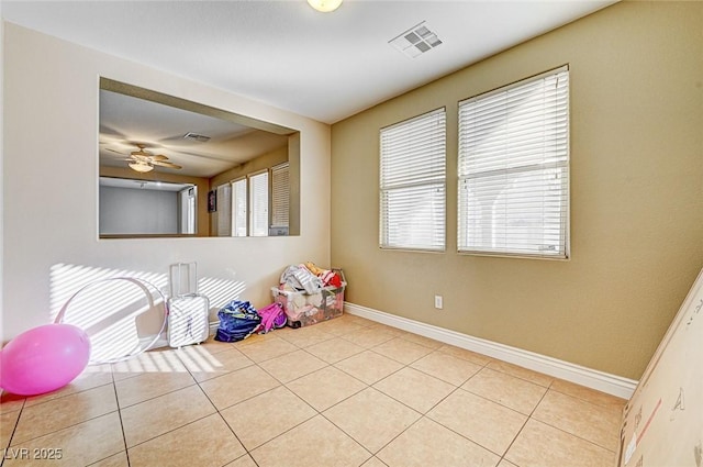 playroom featuring light tile patterned floors and ceiling fan