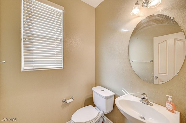 bathroom with sink and toilet