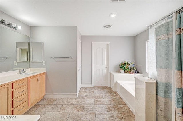 bathroom with independent shower and bath and vanity