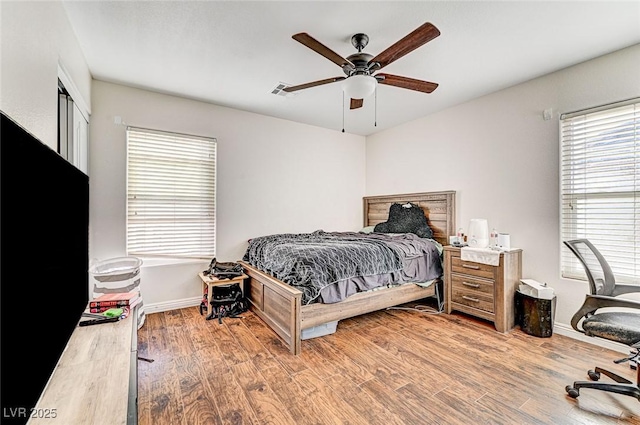 bedroom featuring ceiling fan and light wood-type flooring