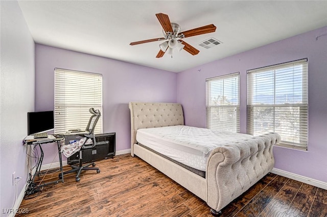 bedroom featuring dark hardwood / wood-style floors and ceiling fan