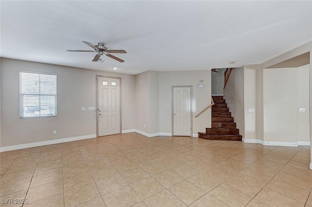 interior space with ceiling fan