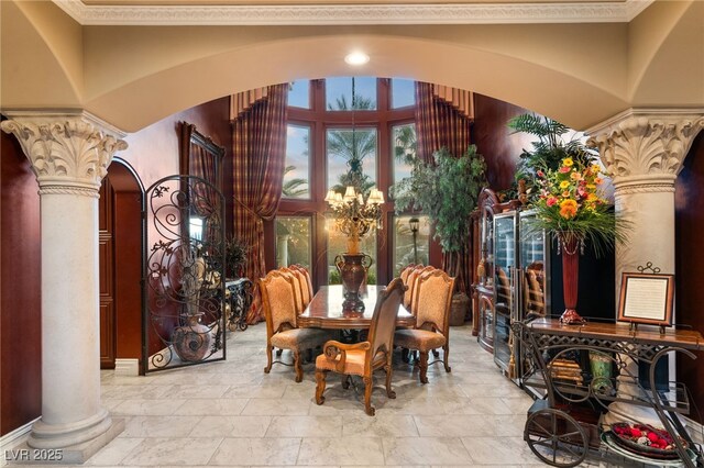 609 China Doll Pl, Henderson, NV 89012 - dining space with ornate columns, crown molding, and a chandelier