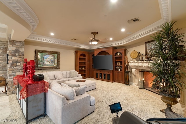 609 China Doll Pl, Henderson, NV 89012 - carpeted home theater with ceiling fan, ornamental molding, and a raised ceiling
