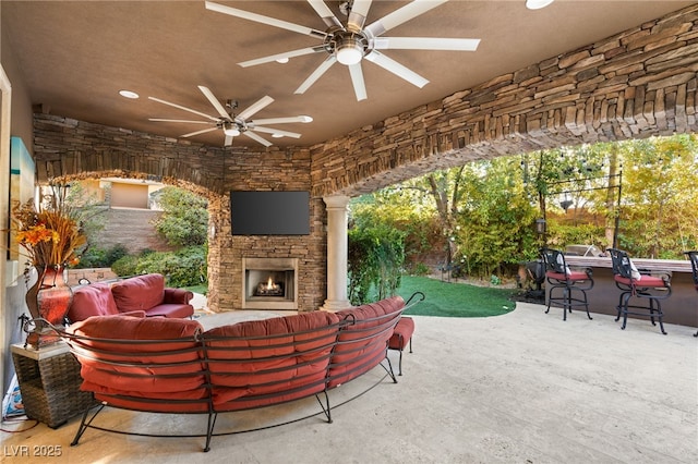 609 China Doll Pl, Henderson, NV 89012 - view of patio featuring ceiling fan, an outdoor living space with a fireplace, and an outdoor bar