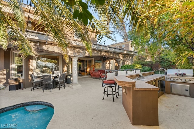 609 China Doll Pl, Henderson, NV 89012 - view of patio with a bar and area for grilling